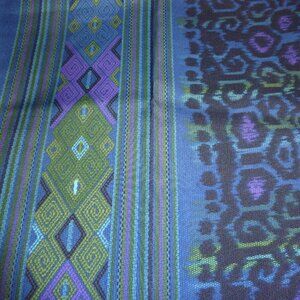 Ethnic patterned fabric with a leopard print center and clean geometric borders